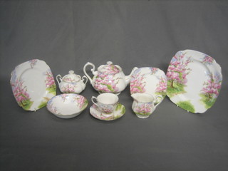 A 39 piece Royal Albert Blossom Time pattern tea service comprising teapot (second), 6 square 9" plates (5 seconds), 6 plates 8" (4 seconds), 6 plates 6" (5 seconds), 6 pudding bowls (5 seconds), 8 saucers (4 seconds, 1 with chip to base), 5 cups (1 chip to rim) cream jug and twin handled sugar bowl (second)