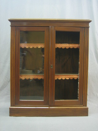 A Victorian walnut bookcase, the interior fitted adjustable shelves enclosed by glazed panelled doors 36"