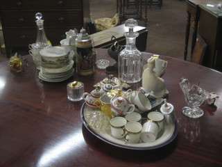 A panel cut club shaped decanter and stopper, an oval blue and white meat plate, a collection of various miniature teapots, a circular glass cigarette lighter by Webb Crystal, 2 metal sugar scuttles etc