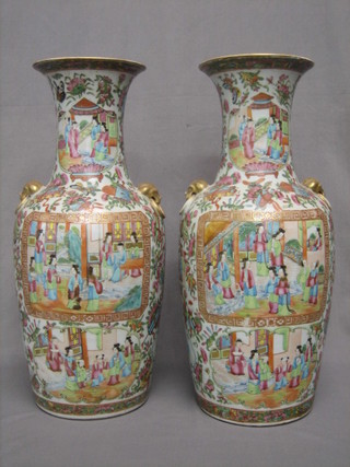 A handsome pair of 19th Century Japanese Canton Famille Rose club shaped porcelain vases decorated courtly figures 18"