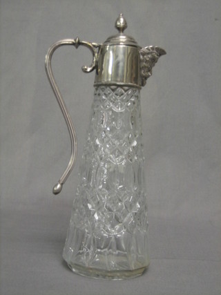 A glass claret jug with silver plated mount