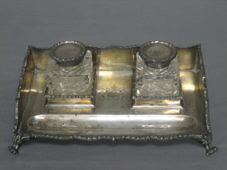 A handsome Edwardian silver 2 bottle ink stand with three-quarter gallery, pen receptacle and fitted 2 glass ink wells, with presentation engraving to Robert Green Esq "As a small token of esteem from Henley Ross Boot Esq, a Past Master of the Cutler's Company 1905" Birmingham 1909, 21 ozs (see also lots 225z and 400) 