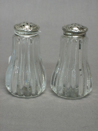 A pair of cut glass peppers with Sterling silver tops, 3"
