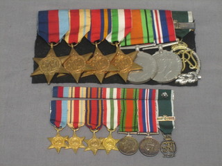 A group of 7 medals comprising 1939-45 Star, Africa Star, Burma Star, Italy Star, British War medal and Victory medal, Royal Naval reserve decoration and bar, together with an associated group of miniatures and a miniature bar of ribbons