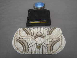 A circular silver plated and blue enamel compact 2", a French black leather compact case and a bead work bag