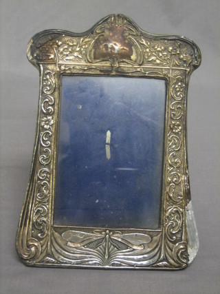 An Edwardian Art Nouveau embossed silver easel photograph frame decorated stylised butterflies, Chester 1905 with crude old repairs