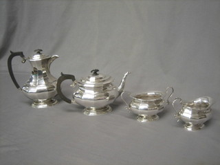 A silver plated 4 piece tea set of oval panelled form comprising teapot, twin handled sugar bowl, cream jug and hotwater jug