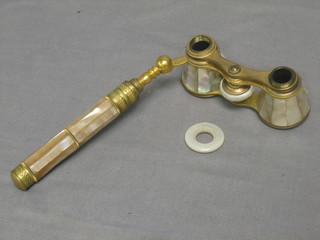 A pair of gilt metal and mother of pearl mounted opera glasses (f)