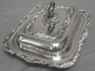 A rectangular silver plated twin section entree dish and cover with cast borders