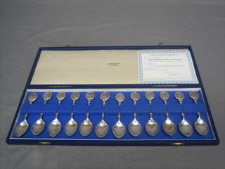 A set of 12 silver teaspoons decorated signs of the Zodiac, 9 ozs, cased