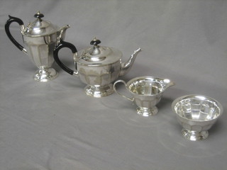 A 1930's 4 piece circular silver plated tea service comprising teapot, sugar bowl, cream jug and hotwater jug