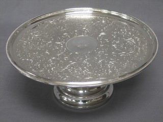A circular silver plated comport 11"