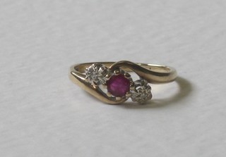 A gold dress ring set rubies and 2 small diamonds