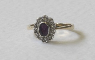 A gold dress ring set an amethyst surrounded by diamonds