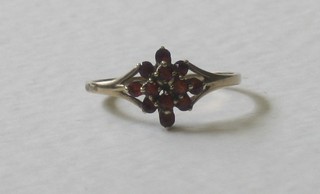 A gold dress ring set red stones