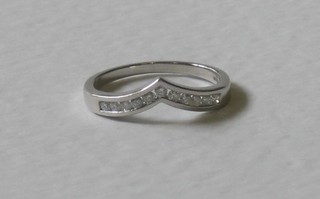 A platinum wishbone shaped ring set diamonds, approx 0.25ct