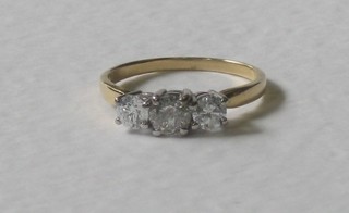 An 18ct yellow gold dress/engagement ring set 3 diamonds, approx 1.01ct