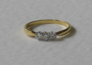 A 18ct yellow gold dress ring set 3 small diamonds, approx 0.20ct