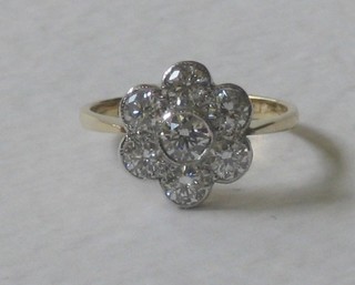 An 18ct yellow gold cluster dress ring set 7 diamonds, approx 1.40ct