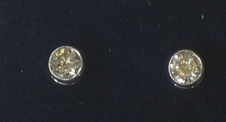A pair of diamond ear studs, approx 0.40ct
