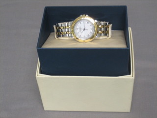 A gentleman's Raymond Weil wristwatch, contained in a gilt metal stainless steel case, boxed