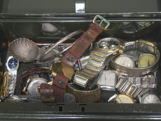 A small metal cash box and a collection of wristwatches
