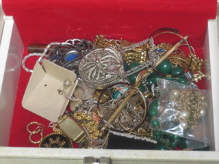 A jewellery box containing various items of costume jewellery