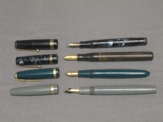 A green Parker fountain pen with 14ct Duofold nib, a brown Waterman fountain pen with Ideal nib, a grey Swan fountain pen and 1 other grey Swan fountain pen