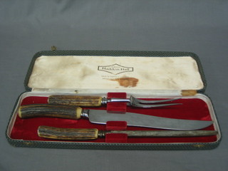 A 3 piece carving set with stag horn handles