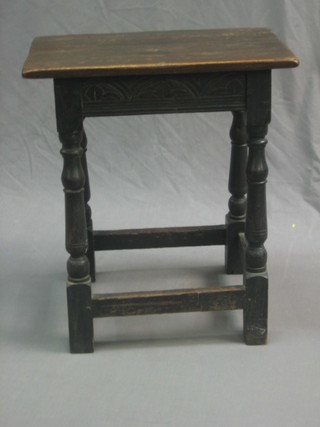 A Victorian carved oak joined stool raised on turned and block supports 18"
