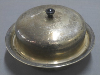 A circular silver plated muffin dish and cover