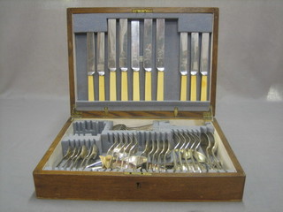 A canteen of silver plated Old English pattern flatware contained in an oak canteen box