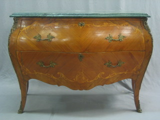 A 20th Century French inlaid Kingwood commode of serpentine outline and bombe form with green veined marble top, fitted 2 long drawers raised on cabriole supports with gilt metal mounts throughout, 46"