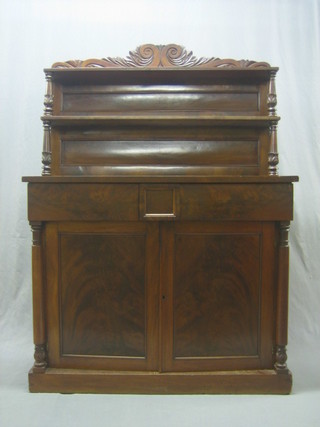 A Victorian mahogany chiffonier with raised back fitted 2 shelves, the base fitted 2 drawers above a double cupboard with columns to the sides, raised on a platform base 43"
