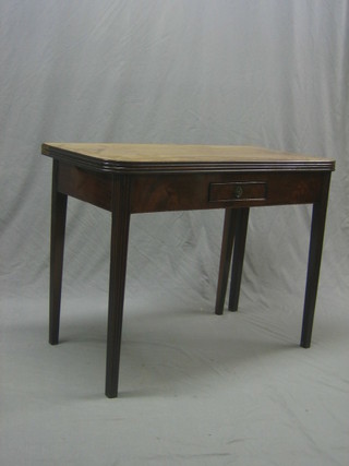 A 19th Century D shaped mahogany card table fitted a drawer and raised on square tapering supports 39"