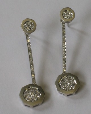 A pair of 18ct white gold drop earrings set diamonds