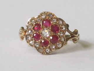 A lady's 18ct yellow gold cluster dress ring set rubies and diamonds