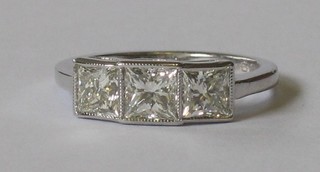 An 18ct white gold dress ring set 3 Princess cut diamonds approx 1.58ct