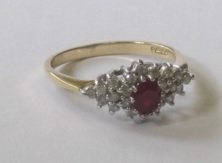 A 9ct gold dress ring set an oval ruby surrounded by diamonds