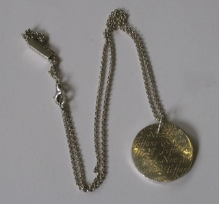 A silver Tiffany pendant, marked Tiffany & Co 925 hung on a silver chain