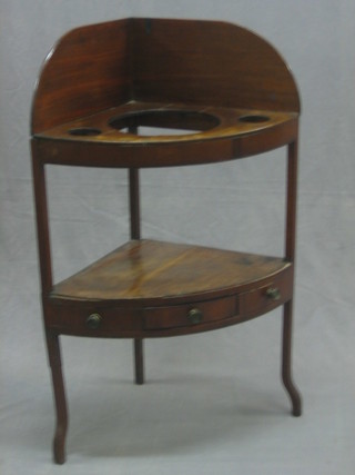 A 19th Century mahogany corner wash stand with raised back, fitted 2 basin recepticals and with undertier shelf 25"