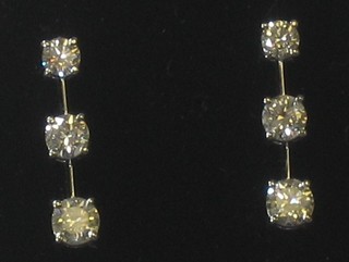 A pair of drop earrings each set 3 diamonds, approx 1.30ct
