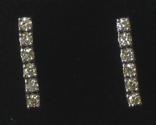 A pair of diamond drop earrings set 6 diamonds