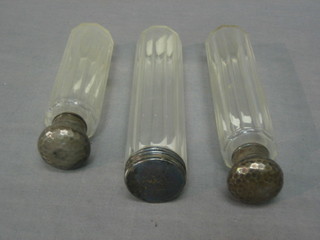 A cut glass pin jar with silver lid and 2 cylindrical glass jars with silver lids