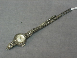A lady's cocktail wristwatch contained in a silver marcasite case