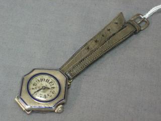 A lady's Edwardian wristwatch contained in a lozenge shaped silver case