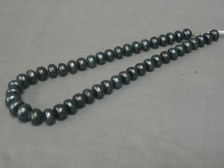 A rope of black freshwater pearls