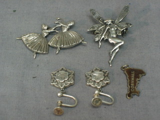 A silver brooch in the form of 2 ballerinas, a brooch in the form of a fairy and a pair of silver earrings