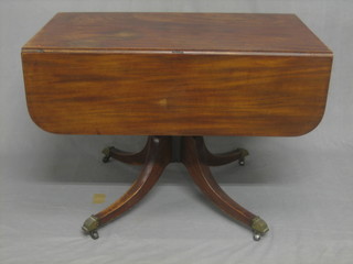 A 19th Century mahogany pedestal Pembroke table fitted a frieze drawer, raised on ring turned and column support 40"