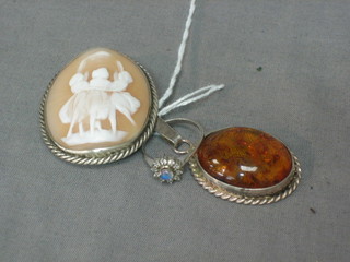 An "amber" pendant, a cameo brooch and a silver dress ring